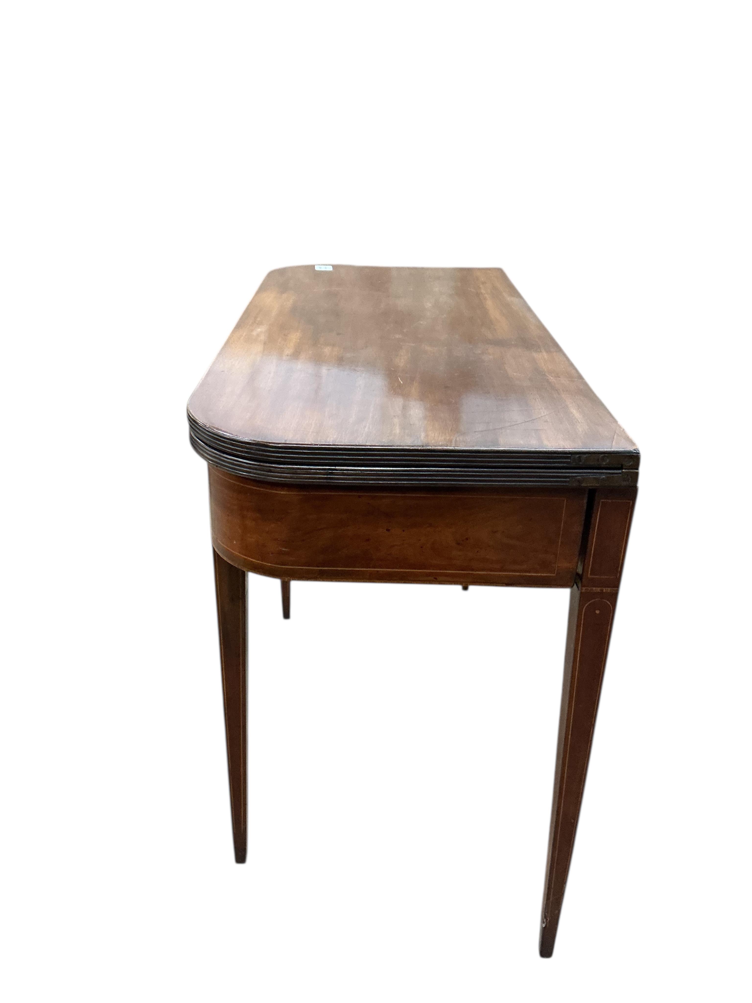 A George III mahogany D shaped folding tea table, width 97cm, depth 46cm, height 75cm